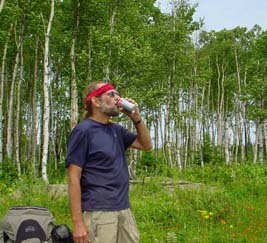 Me drinking coke on Mount Siskiwit